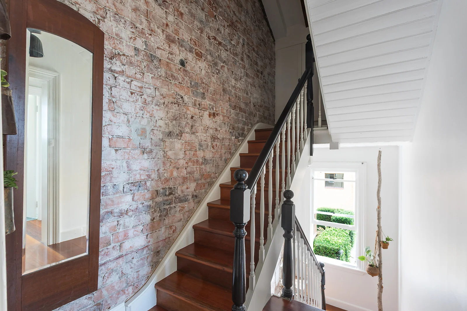 Potts Point Victorian terrace — staircase with exposed brick